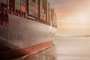 Cargo containers being loaded at a Gulf port