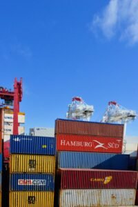 Refrigerated cargo containers being loaded for temperature-controlled shipping