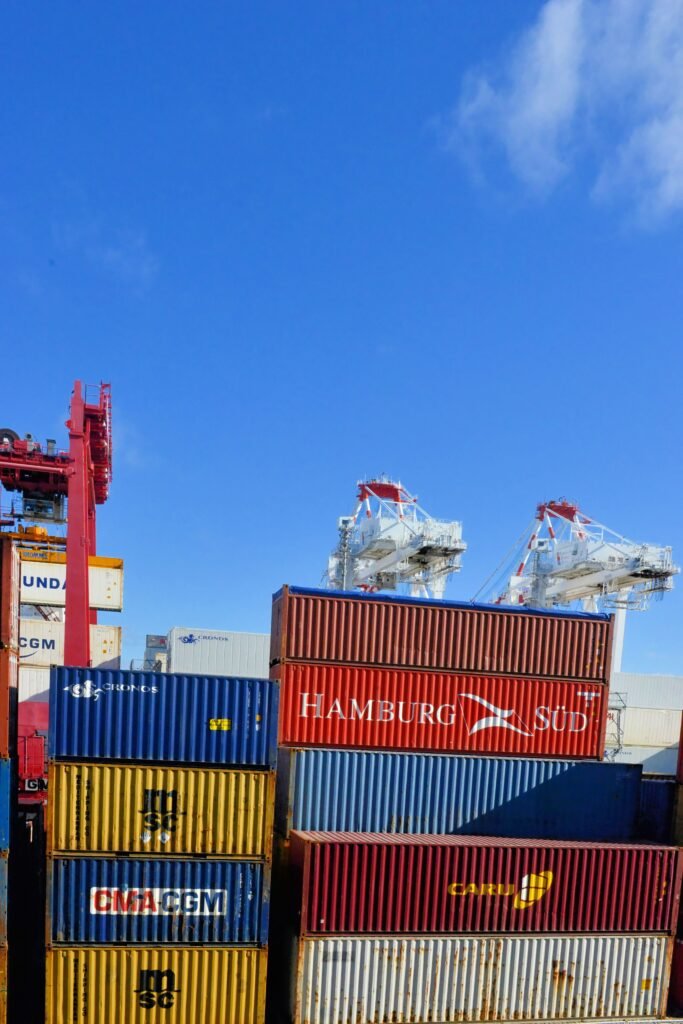 Refrigerated cargo containers being loaded for temperature-controlled shipping